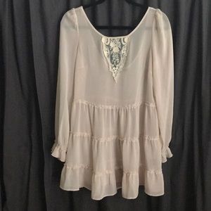 Sheer cream tunic.